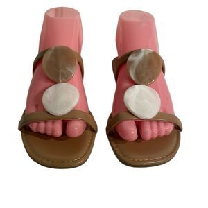 Bamboo women’s tan and white slip on sandals with large medallions. Size 6